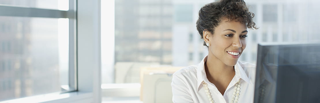  Businesswoman working at desk in office